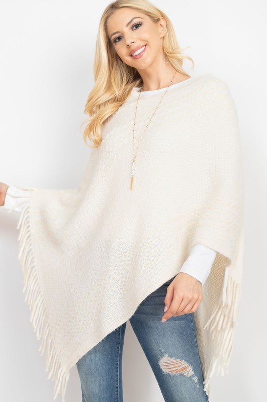 STRIPED KNIT TASSEL PONCHO