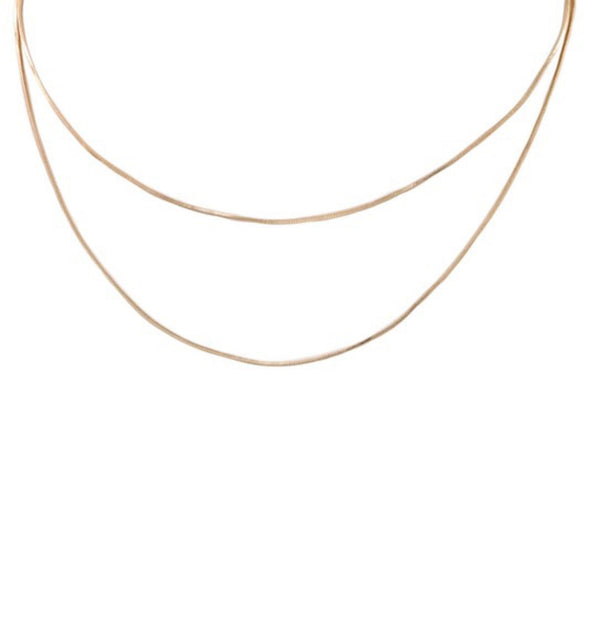 Long layered gold colored necklace